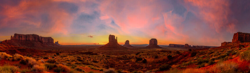 Panoramic in Monument Valley National Park at orange sunrise, Utah. United States