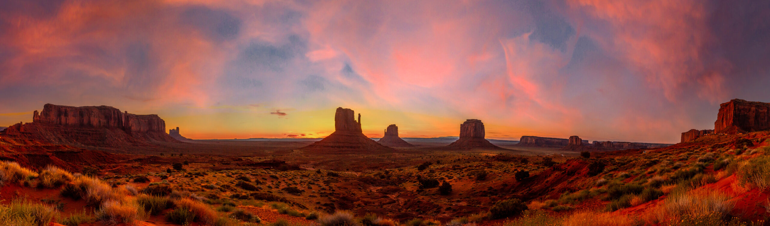 Panoramic in Monument Valley National Park at orange sunrise, Utah. United States